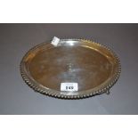 George IV oval silver card salver (with inscription) with a gadroon rim on four claw supports,