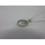 Small modern 18ct white gold and diamond set pendant CONDITION REPORT 1.