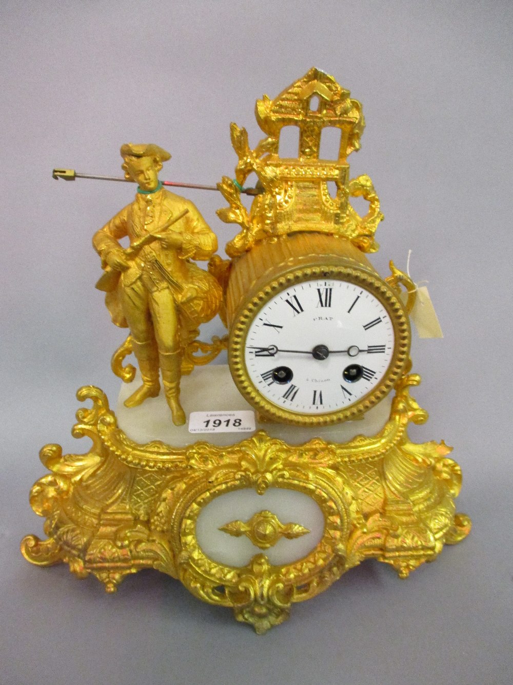 Gilt metal figural mantel clock in the form of a huntsman, the dial signed Prat a Chinon,