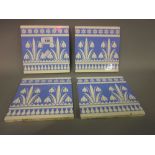 Set of four Mintons China Works tiles decorated with snowdrop design by Christopher Dresser,