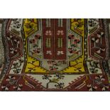 Turkish floral geometric pattern rug on wine ground,