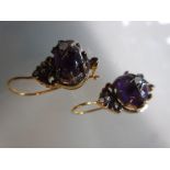 Pair of fish hook studs set with amethyst and diamonds