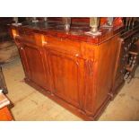 Victorian mahogany chiffonier with a shaped and carved back above two drawers and two cupboard