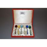 Cased set of six Danish silver and coloured enamel coffee spoons (one at fault)