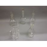 Four 19th Century clear cut glass decanters with stoppers,