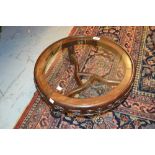 Mid 20th Century Chinese hardwood circular low stand / table on three shaped supports with