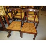 Pair of 19th Century mahogany rail back side chairs with cane seats together with an early 20th