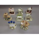 Collection of eight various Coalport porcelain model cottages and pastille burners