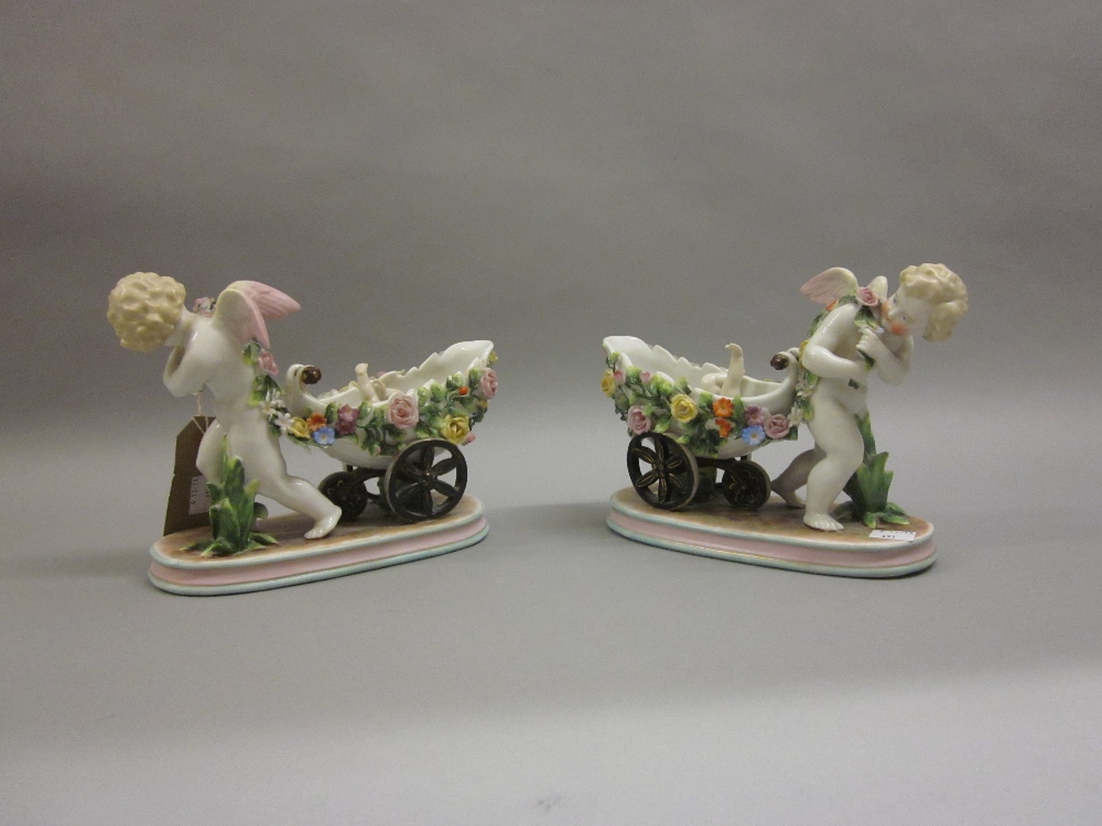 Pair of late 19th Century Continental porcelain figural vases,