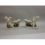Pair of late 19th Century Continental porcelain figural vases,