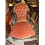 Victorian walnut and button upholstered open arm drawing room chair,