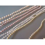 Group of four various cultured pearl necklaces with 9ct gold clasps