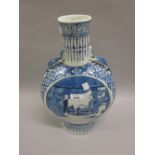 Large Chinese porcelain moon flask decorated in blue and white with figures on a terrace