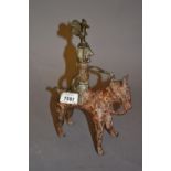 Eastern patinated metal figure of a man on horseback