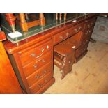 Early to mid 20th Century mahogany twin pedestal desk with a green leather inset top above pull-out