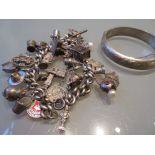 Silver charm bracelet with various charms,