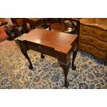 George III rectangular inverted breakfront fold-over card table raised on carved cabriole claw and