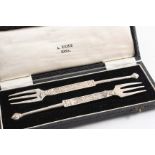 A PAIR OF EARLY 20TH CENTURY SCOTTISH PROVINCIAL THREE-PRONG FORKS after the antique, by Alexander