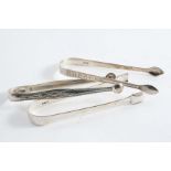 THREE PAIRS OF SUGAR TONGS:- An engraved pair, initialled, by Peter, Anne & William Bateman,