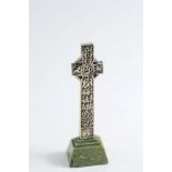 AN EARLY 20TH CENTURY SMALL PLATED REPLICA OF ST. MARTIN'S CROSS, IONA on a green marble base, by