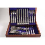 A CASE CONTAINING EIGHT PAIRS OF WILLIAM IV QUEEN'S PATTERN DESSERT KNIVES & FORKS with loaded