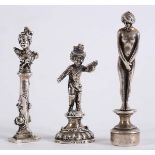 THREE DESK SEALS A child musician, Continental (import marks for 1894); 5.25 cms, another in the