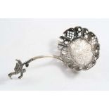 A LATE 18TH CENTURY DUTCH SIFTER SPOON with a short scroll stem surmounted by a bird, maker's