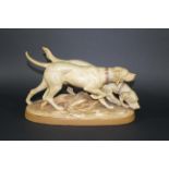 ROYAL DUX GROUP - GUN DOGS a pair of Gun Dogs on the scent, mounted on an oval base. Triangle mark