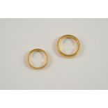 A 22CT. GOLD WEDDING BAND 10.2 grams, together with another 22ct. gold wedding band, 4.7 grams.