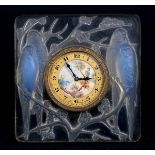 LALIQUE TIMEPIECE - INSEPERABLES an opalescent and clear glass clock in the Inseperables design, the