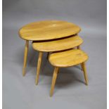 ERCOL 'PEBBLE' NEST OF TABLES a set of three light coloured elm 'Pebble' coffee tables, also with