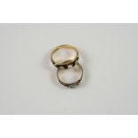 A GEORGE III DIAMOND AND PEARL MOURNING RING the 18ct. gold and black enamel band is mounted with