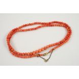 A SINGLE ROW GRADUATED CORAL BEAD NECKLACE the coral beads graduate from approximately 4.3 to 8.