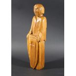 CARVED OAK RELIGIOUS FIGURE in the style of Robert Thompson (Mouseman), a carved oak religious