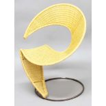 VITTORIO BONACINA ITALIAN DESIGNER CHAIR an interested curved rattan chair supported on a heavy