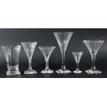 EXTENSIVE SUITE OF ART DECO STYLE DRINKING GLASSES, in the manner of Baccarat, each of faceted