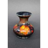 SMALL MOORCROFT FLAMBE VASE a small Moorcroft vase in the Leaf and Berry design, with a flambe