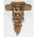 BLACK FOREST CARVED OAK BRACKET, mid 19th century, the shaped shelf above a stag and fruit, height