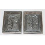 PAIR OF OAK PANELS, probably 18th century, each carved with a flowering plant, 34cm x 28cm (2)