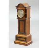 Miniature Longcase Clock with Key MINIATURE MAHOGANY LONGCASE CLOCK, the 3 1/4" silvered dial on a