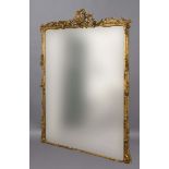 GILT GESSO OVERMANTEL MIRROR, 19th Century, the shaped rectangular plate beneath a scrolling, floral