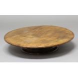 MAHOGANY LAZY SUSAN, probably late 19th century, on a turned foot, height 12cm, diameter 61cm