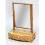 GEORGE III MAHOGANY BOW FRONTED TOILET MIRROR, the rectangular plate on a base with three drawers,