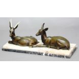 AFTER LAURENT, Art Deco style group of two recumbent dear, patinated bronze with ivory antlers and