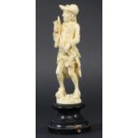 DIEPPE IVORY FIGURE, 19th century, of a gentleman carrying a butterfly net and a butterfly, height