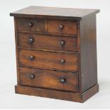 ROSEWOOD MNIATURE CHEST, 19th century, two short or three long drawers with turned pulls, height