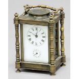 BRASS FOUR PANE CARRIAGE CLOCK the enamelled dial with centre sweep seconds hand, subsidiary alarm