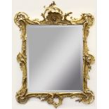 FLORENTINE STYLE GILT GESSO WALL MIRROR, the bevelled rectangular plate beneath a rococo style