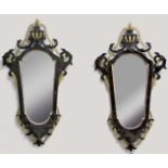 PAIR OF GEORGE III STYLE MAHOGANY AND GILT WALL MIRRORS, the shaped plates beneath an urn and
