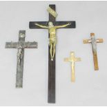 BRASS CRUCIFIX, late 19th century, on a hardwood cross, height of figure 27cm; together with three
